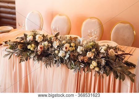 The Presidium With Fresh Flowers Of The Newlyweds At The Wedding