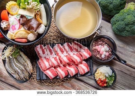 Japanese Nabemono Hotpot Dish Of Thinly Sliced Meat And Vegetables Boiled In Water And Served With D