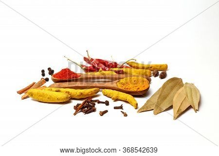 Spices And Dry Herbs On White Background