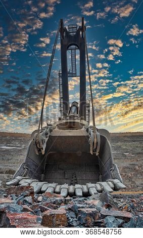 giant shovel of an excavator digging kimberlite in a diamond mine in Botswana