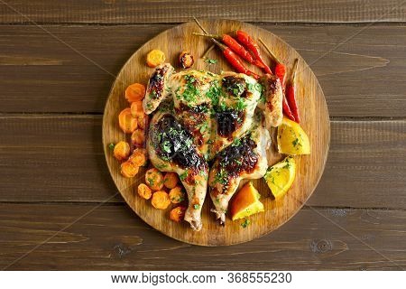 Grilled Spatchcock Chicken On Wooden Table. Top View, Flat Lay