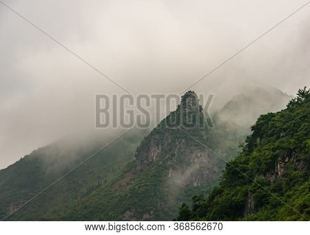 Wushan, Hubei, China - May 7, 2010: Wu Gorge In Yangtze River. Green Forested Mountain Peaks In Thic
