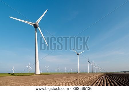 Windmill Park Westermeerdijk Netherlands, Wind Mill Turbine With Blue Sky In Ocean, Green Energy