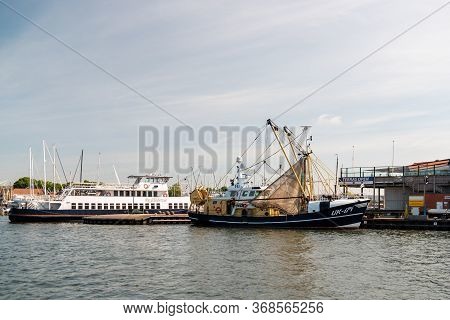Urk Netherlands May 2020, Fishing Boats In The Harbor Of Urk Preparing For Going Back Fishing After 