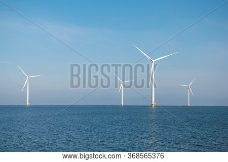 Windmill Park Westermeerdijk Netherlands, Wind Mill Turbine With Blue Sky In Ocean, Green Energy