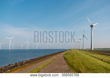 Windmill Park Westermeerdijk Netherlands, Wind Mill Turbine With Blue Sky In Ocean, Green Energy
