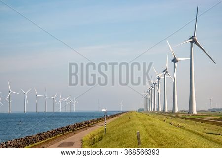 Windmill Park Westermeerdijk Netherlands, Wind Mill Turbine With Blue Sky In Ocean, Green Energy