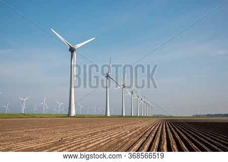 Windmill Park Westermeerdijk Netherlands, Wind Mill Turbine With Blue Sky In Ocean, Green Energy