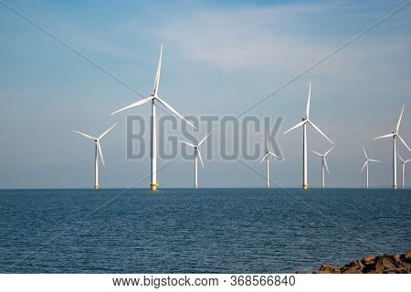 Windmill Park Westermeerdijk Netherlands, Wind Mill Turbine With Blue Sky In Ocean, Green Energy