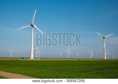 Windmill Park Westermeerdijk Netherlands, Wind Mill Turbine With Blue Sky In Ocean, Green Energy