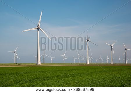 Windmill Park Westermeerdijk Netherlands, Wind Mill Turbine With Blue Sky In Ocean, Green Energy