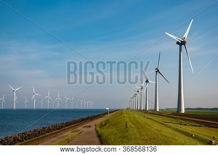 Windmill Park Westermeerdijk Netherlands, Wind Mill Turbine With Blue Sky In Ocean, Green Energy
