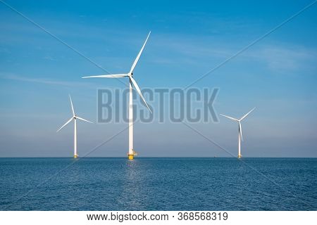 Windmill Park Westermeerdijk Netherlands, Wind Mill Turbine With Blue Sky In Ocean, Green Energy