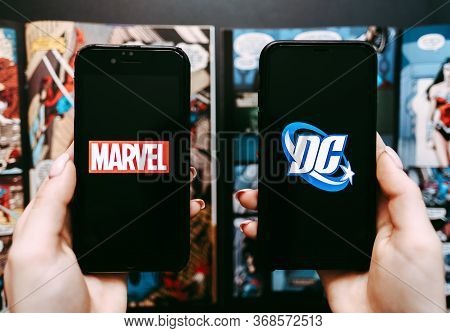 Marvel And Dc Comics Logo On The Comics Page Background.
