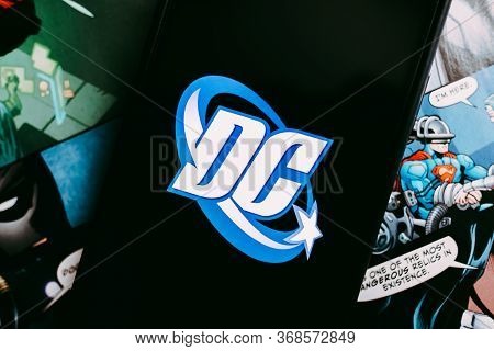 Dc Comics Logo On The Comics Page Background.