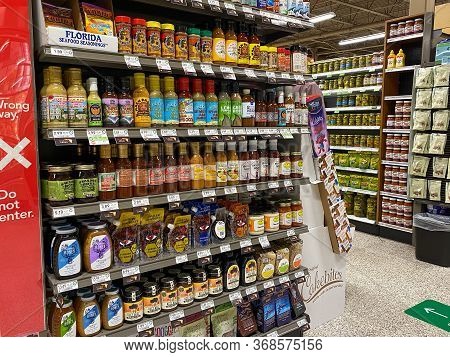 Orlando,fl/usa -5/6/20:  The Sauce Aisle Including Barbecue And Honey Marinades For Meat At A Public