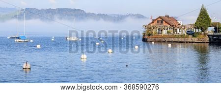 Panoramic View Of The Lake Zug In The Early Spring Morning Near Village Walchwil. Canton Of Zug, Swi