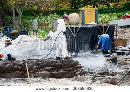 Rayong,thailand-february 8,2013 : Unidentified Workers And Volunteers Are Spraying Chemicals Onto Cr