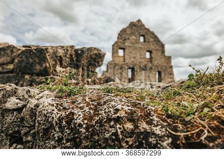 Remains Of The Old Castle Ruin Hohenurach In Germany, With A Dramatc Sky.