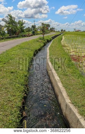 Irrigation Canal Called Subak, A Traditional Way Of Bringing Water To The Fields And Rice Terraces I