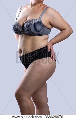 Woman Real Body Plus size Model in lingerie posign, imperfect nonideal