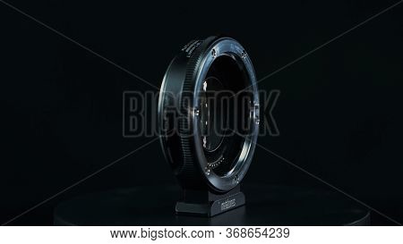 Tomsk, Russia - May 28, 2020: Metabones Speedbooster 0.71 Ultra Standing On A Black Turntable, Micro