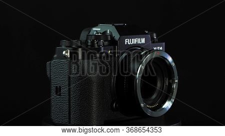 Tomsk, Russia - May 28, 2020: Fujifilm X-t4 Body With Fringer Ef-fx Proii Adapter Standing On A Blac