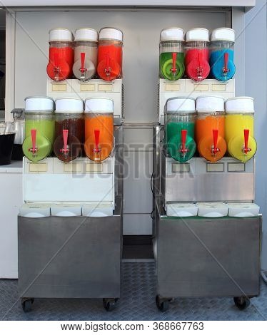 Many Flavors Of Iced Slush With The Dispenser Without People