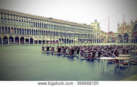 Venice In Italy Submerged By High Tide And Water In Saint Mark Square With Old Toned Effect