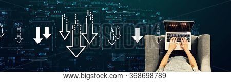 Descending Arrows With Person Using A Laptop In A Chair
