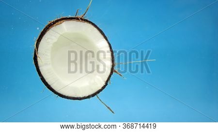 Coconut Under Blue Water, Coconut Oil And Milk, An Exotic Tropical Diet Prod