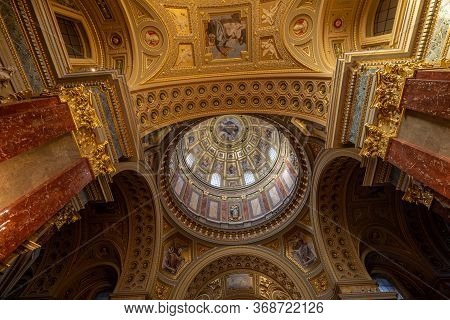 Budapest, Hungary - Feb 8, 2020: Ultrawide View Of Godlen Dome Interior Of St. Stephen Basilica