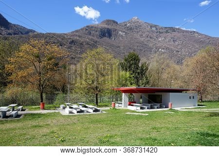 Public Rest area with WC on the highway near the town of Moleno on a sunny spring day. View of the Alps. Moleno, district of Bellinzona in the canton of Ticino, Switzerland.