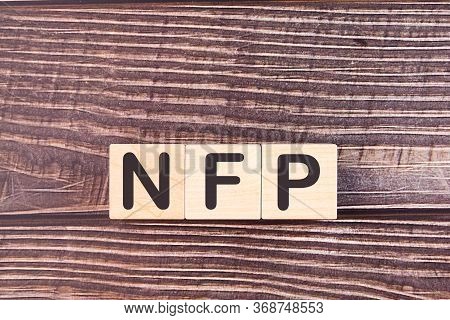 Word Acronym Nfp As Not For Profit Is Made Of Wooden Building Blocks. Concept.