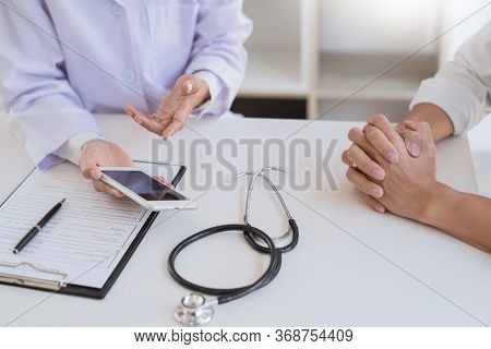 Doctor Giving Consulting And Diagnostic To Patient And Explaining Medical Informations Prevention Di