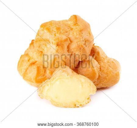 Homemade Profiteroles With Cream, Isolated On A White Background. Fresh Baked Golden Profiterole. Cu