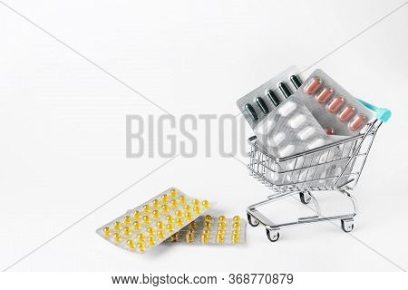 Shopping Cart With Many Pills And Drugs. Free Space For Text