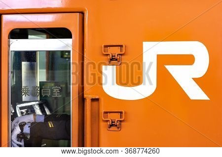 Osaka / Japan - November 10, 2017: Train Driver In The Cabin Of Japan Railways Train In Osaka, Japan