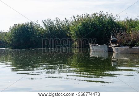 Fishing Boat In A Calm Lake Water. Old Wooden Fishing Boat.eber Lake,afyon In Turkey