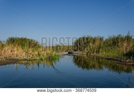 Fishing Boat In A Calm Lake Water. Old Wooden Fishing Boat.eber Lake,afyon In Turkey