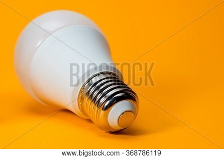 Led, New Technology Light Bulb On Yellow Background, Energy Super Saving Electric Lamp Is Good For E