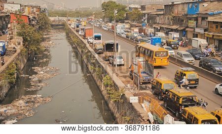 Mumbai, India - December 17, 2018: Dirty River In Dharavi Slums. Mumbai. India.
