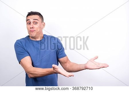 Smiling Man Pointing To Copy Space