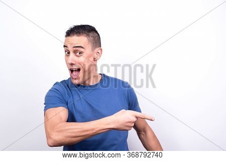 Smiling Man Pointing To Copy Space