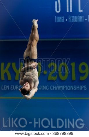Kyiv, Ukraine - August 7, 2019: Oleg Kolodiy Of Ukraine Performs During Mens 1m Springboard Final Of