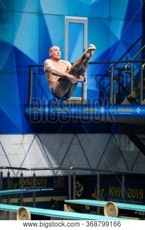 Kyiv, Ukraine - August 9, 2019: Evgeny Kuznetsov Of Russia Performs During Mens 3m Springboard Final