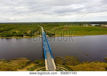 Aerial Panoramic View From Above To The Bridge Over The River Lielupe Near Kalnciems, Latvia