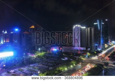 Guangzhou, China.  June 16, 2016. Modern Skyscrapers Lit Up At Night On Tianhe Road In Tianhe Distri