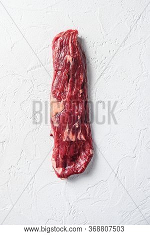 Raw Skirt, Machete Steak On A White Stone Background Vertical