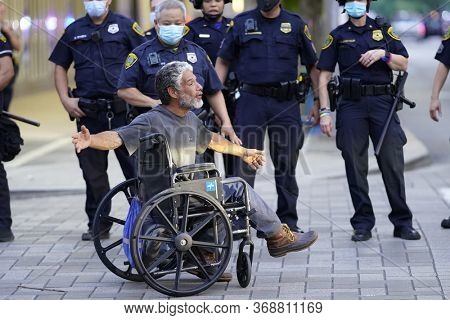 May 29, 2020 - Houston, Texas, USA: Police and spectators collide in downtown Houston, TX as rioters protest the beating and killing of George Floyd by Minneapolis police earlier in the week.